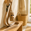Easy-clip dog poop bag holder on leash in warm home entryway